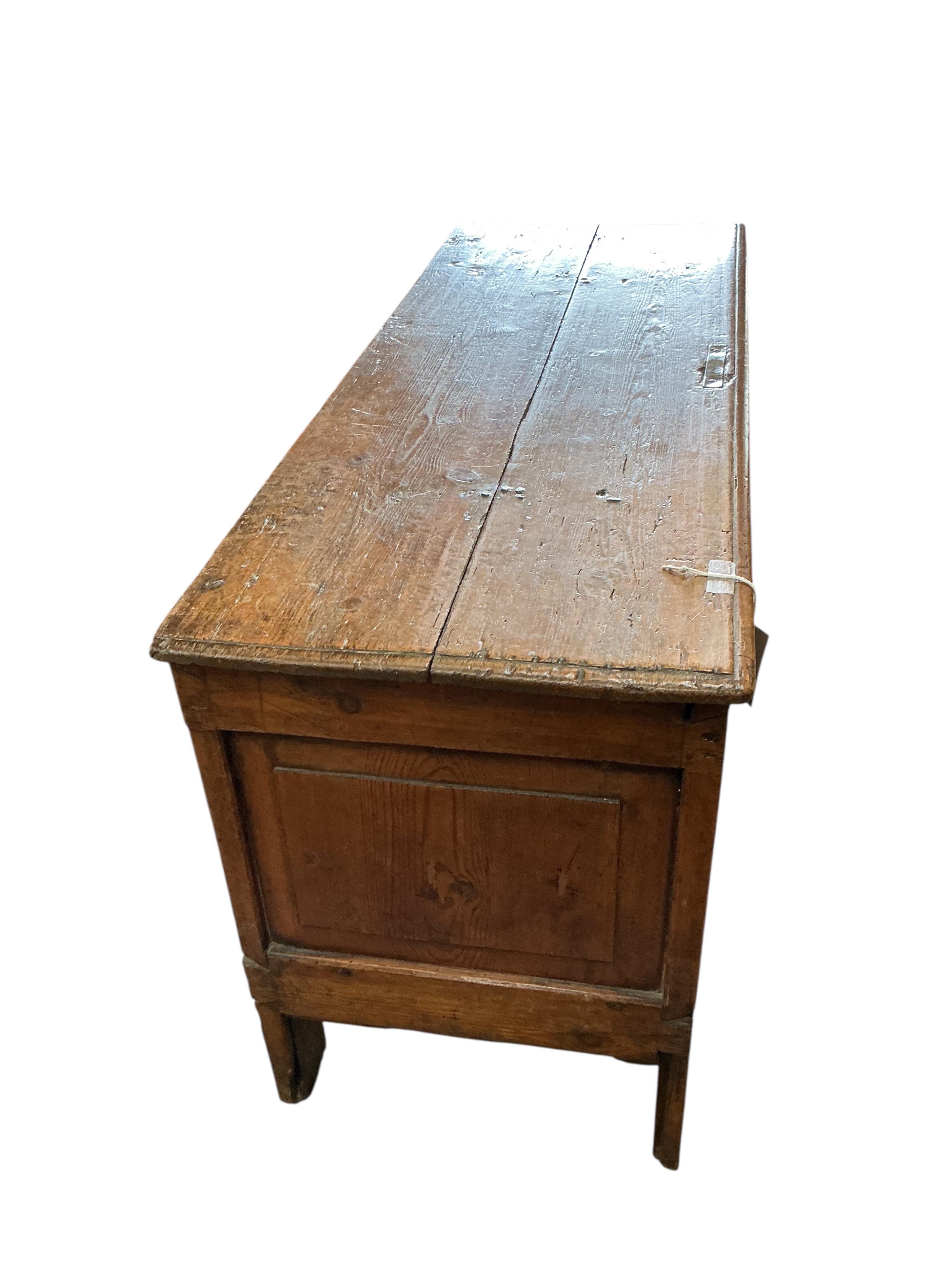 An 18th century panelled pine coffer, width 111cm, depth 42cm, height 62cm